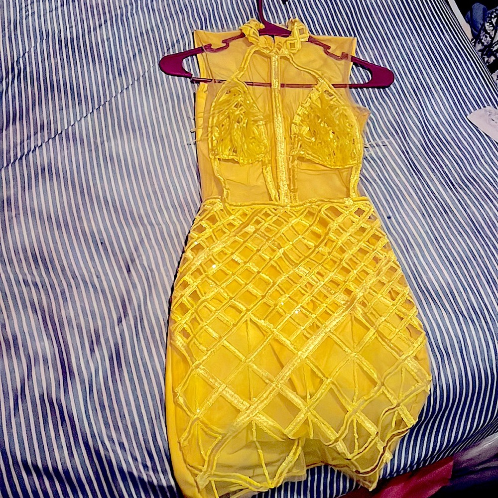 This is a Beautiful yellow dress from Dach Boutique